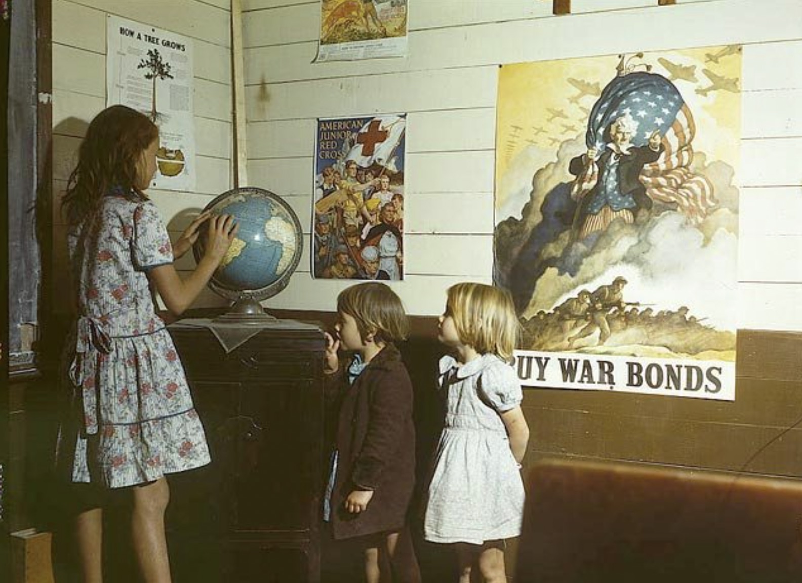 Rural school children in front of homefront posters in San Augustine County, Texas 